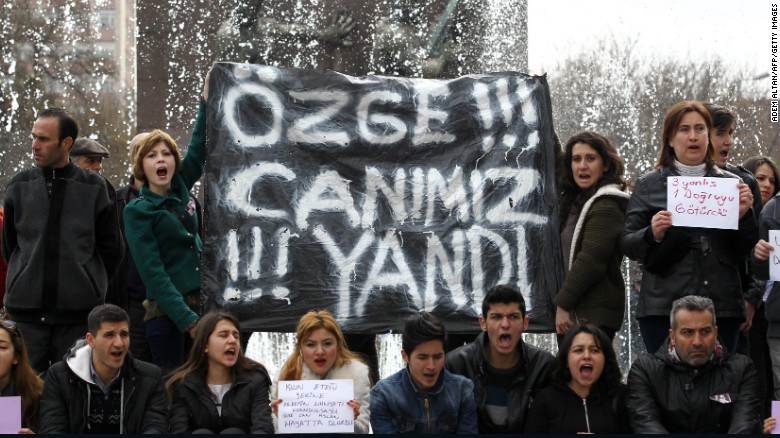 Protesters hold a banner reading ‘Ozge, we have suffered with you’ during a demonstration in Ankara.